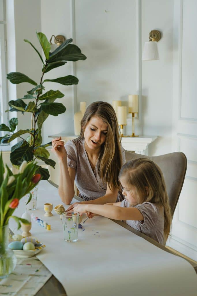 Parent and child spending calm time together at home, supported by reliable childcare systems that allow presence without constant coordination